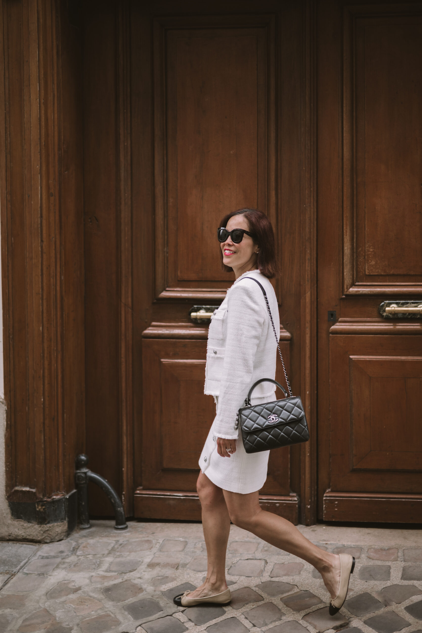 Woman wearing ballet flats in Paris.