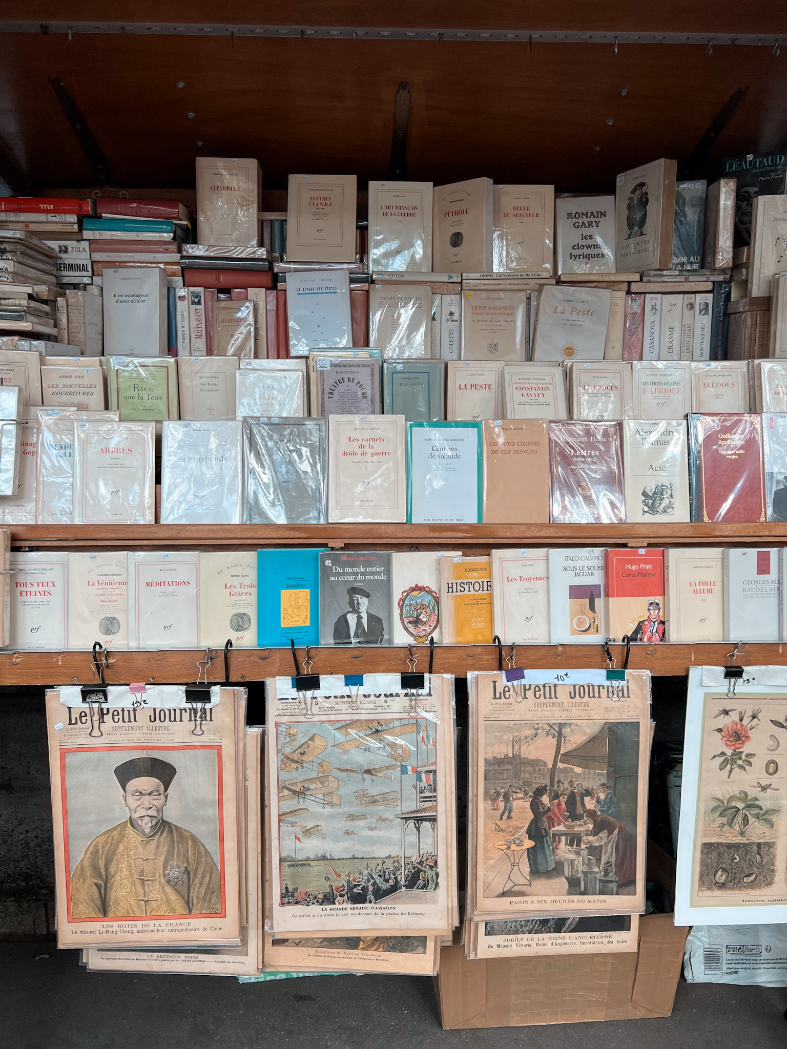Boquinistas in Paris along seine with books and magazines.