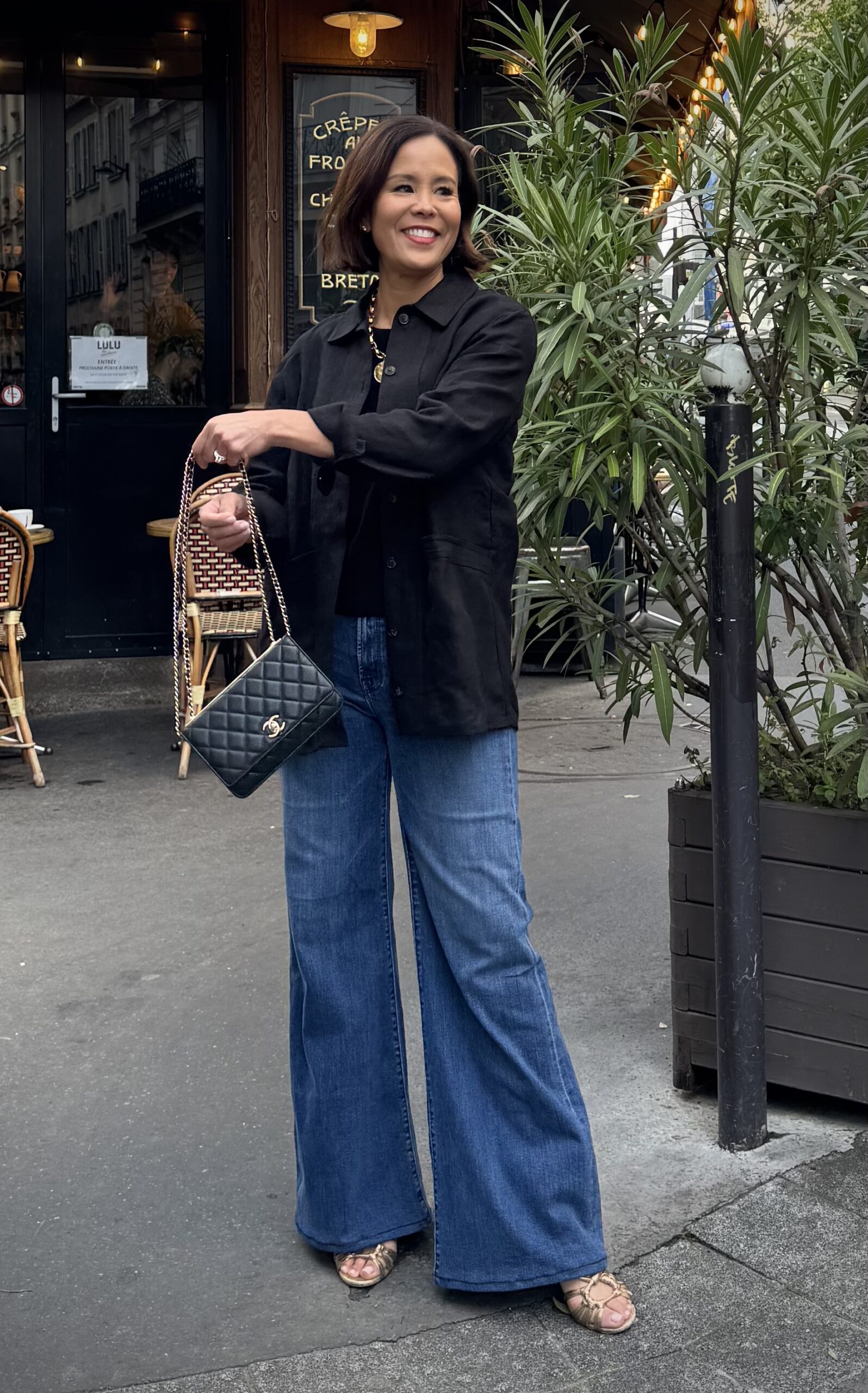 WOMAN WEARING BLACK WILL JACKET FROM SEZANE.