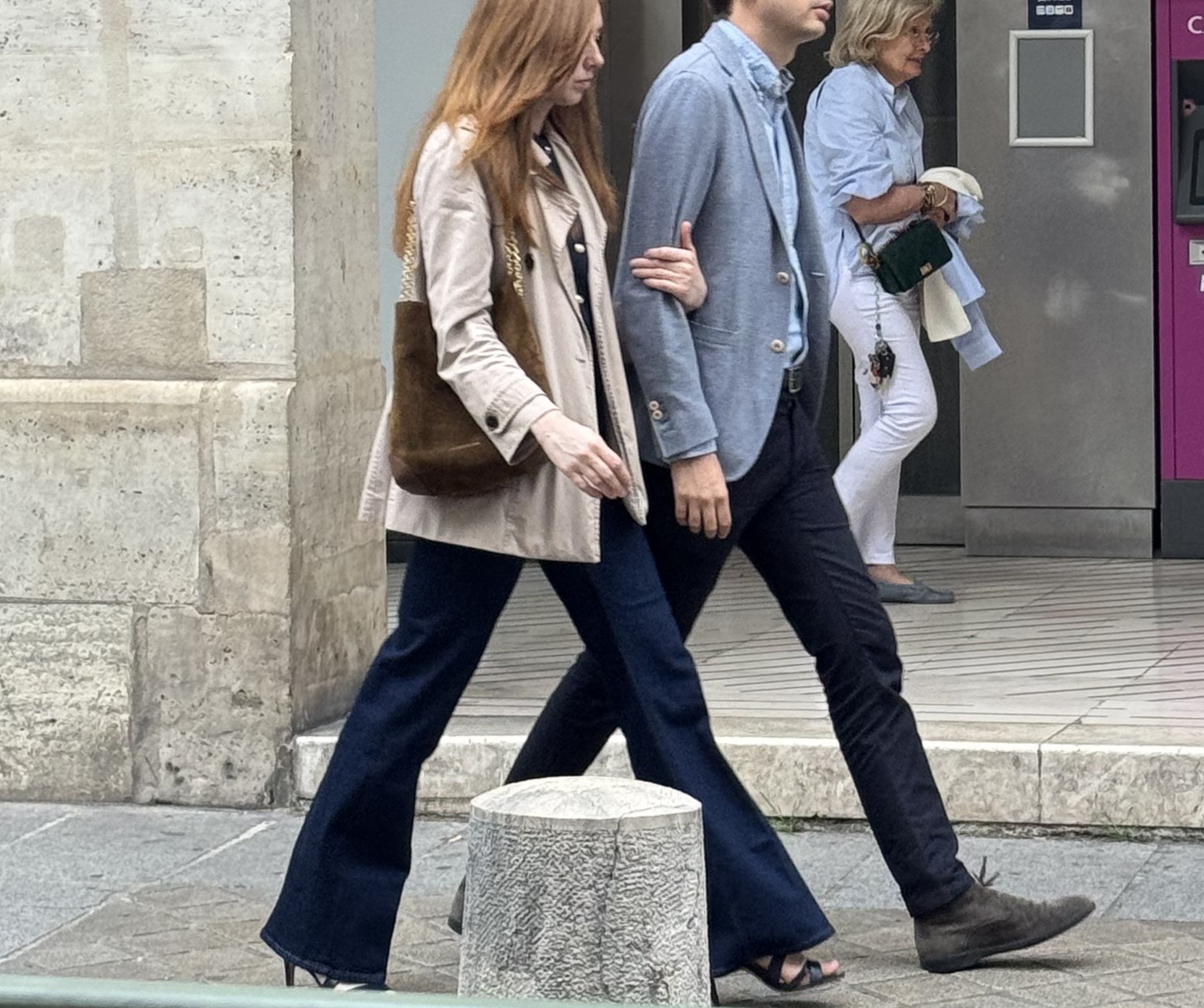 Man and woman walking together in paris on the streets.