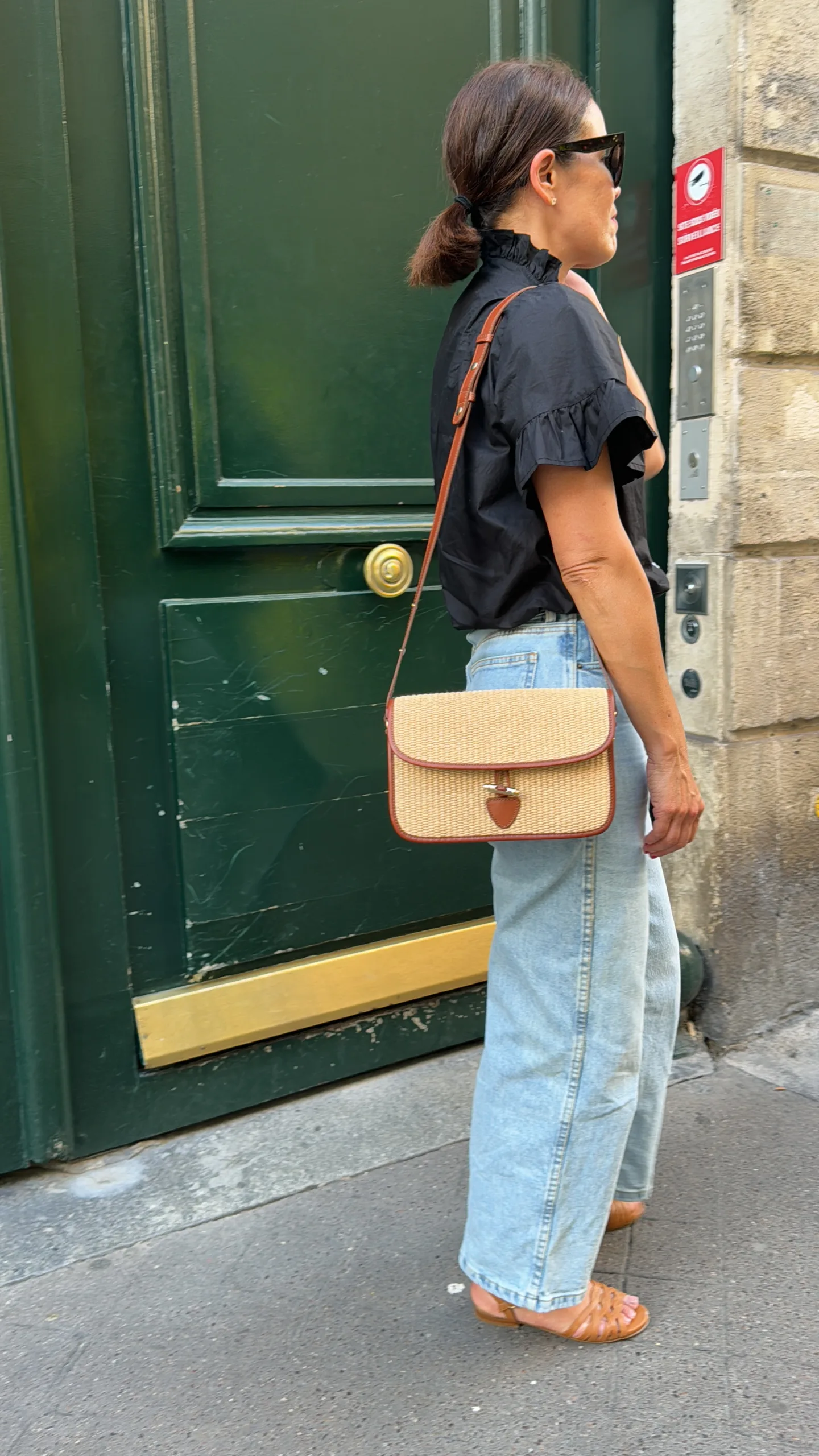 French essentials of crossbody bag and sandals. 