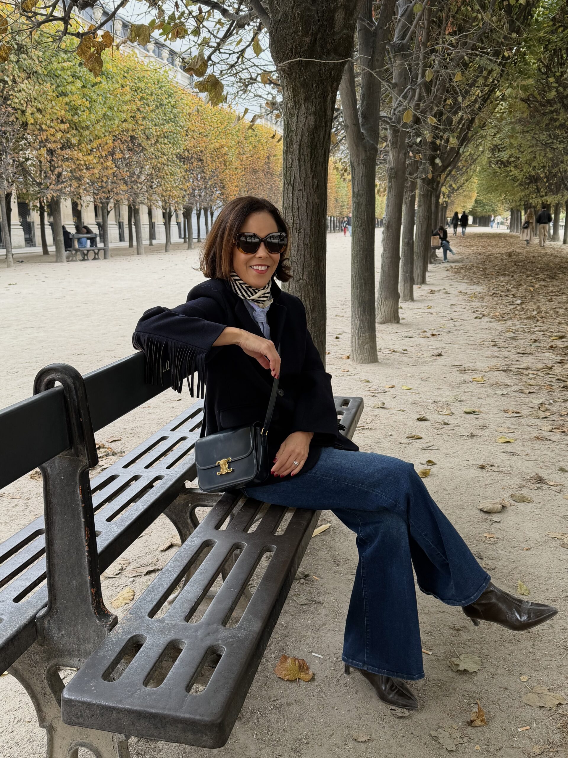 Fall outfit on a bench in Luxembourg Gardens Paris