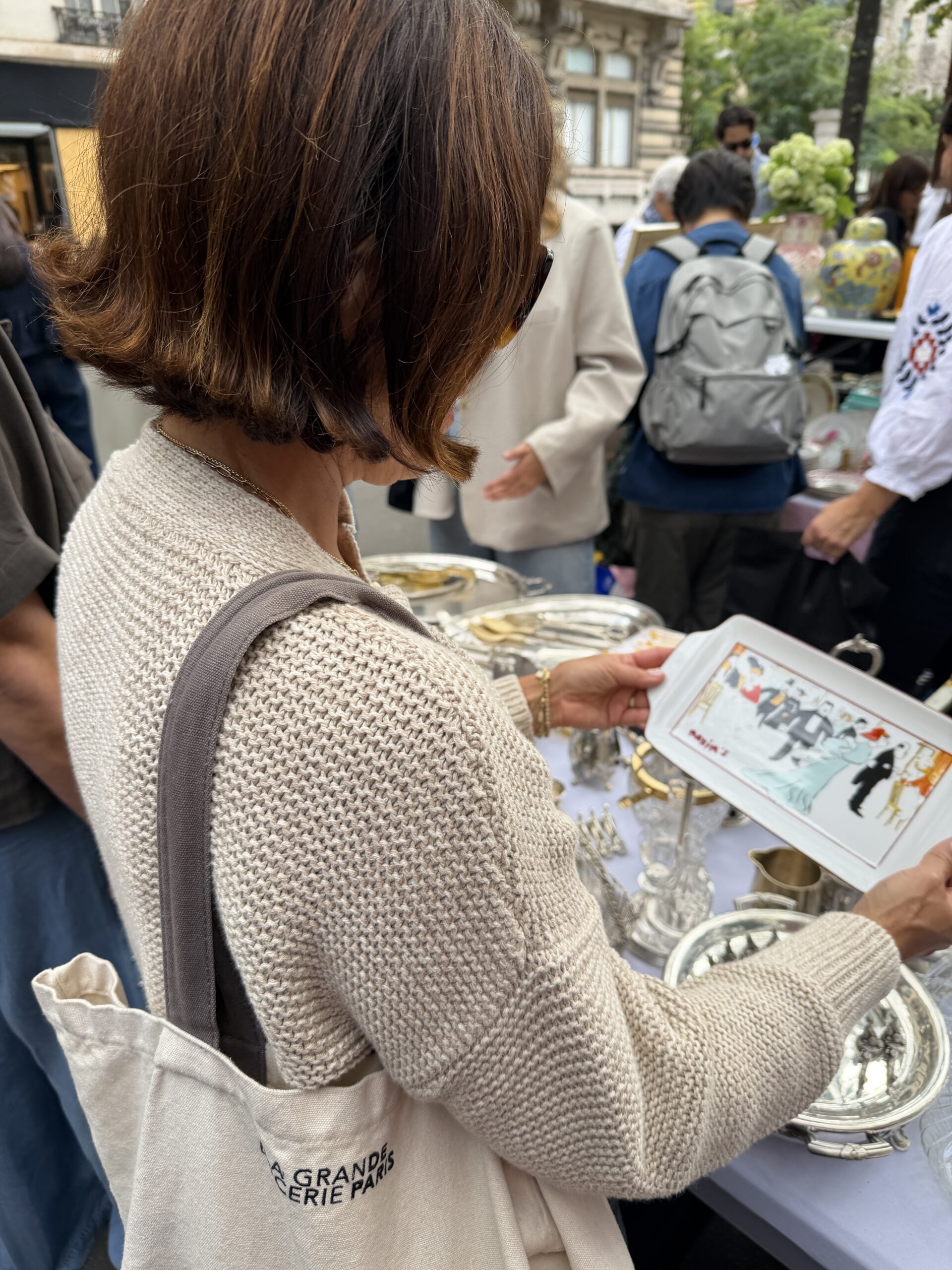 Shopping for vintage finds at a Paris flea market in the fall