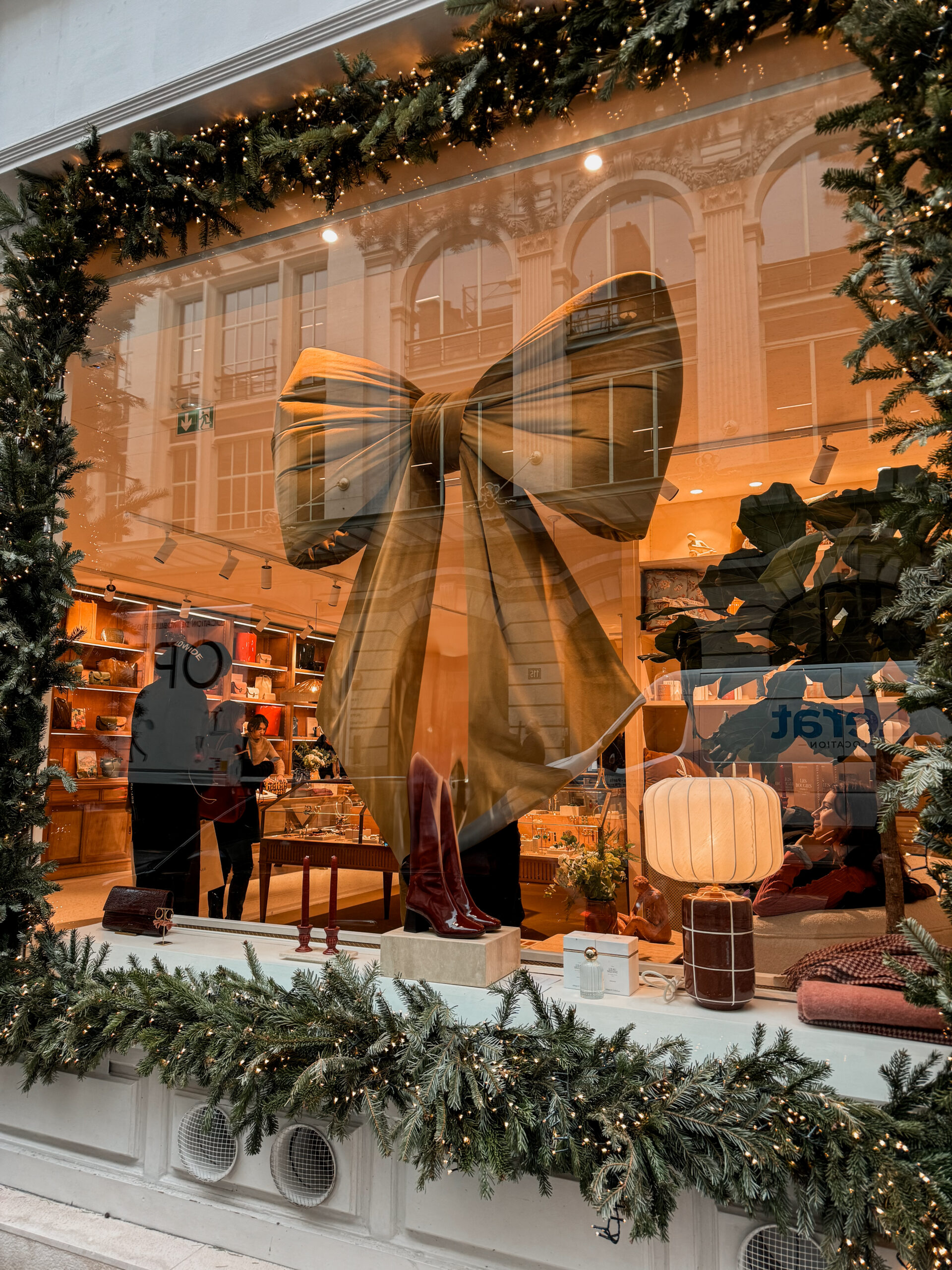 Gold bow in sezane window at christmas.