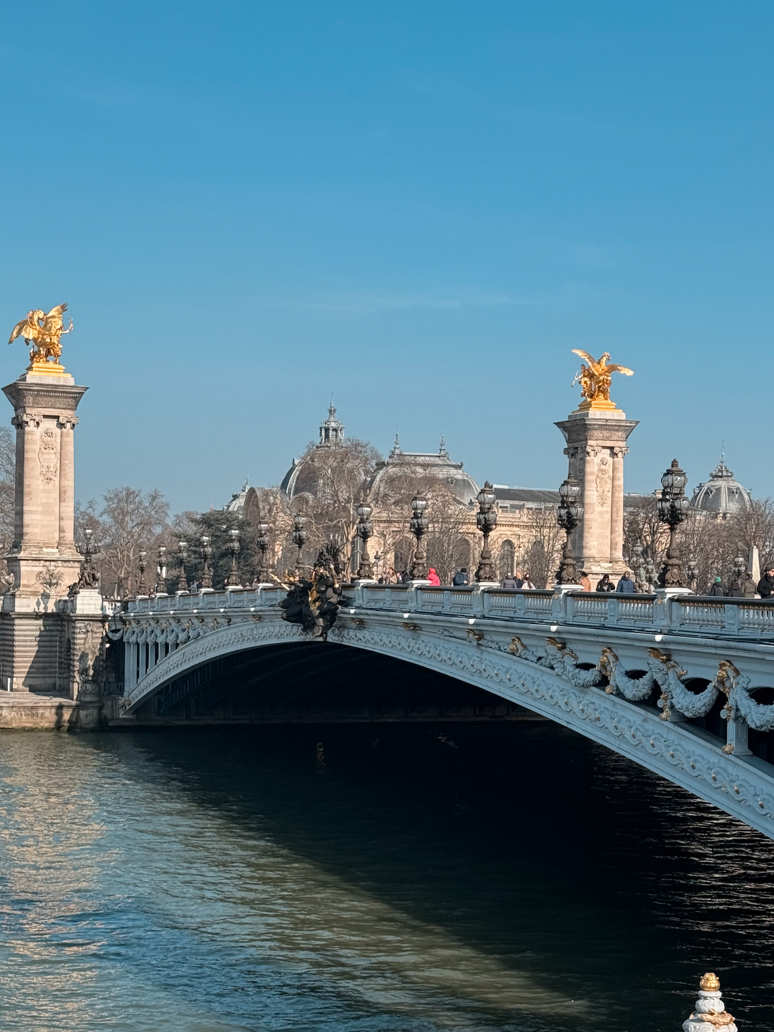 Alexander Pont III bridge in Paris during the winter when the sun in shining.