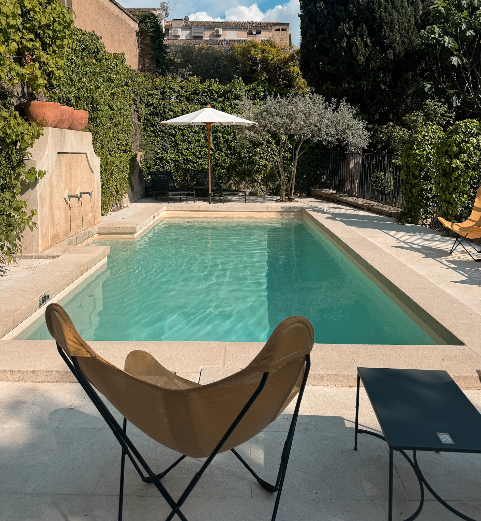 Boutique hotel pool in Lourmarin during summer, the best time to visit Lourmarin for warm weather and relaxed Provence living