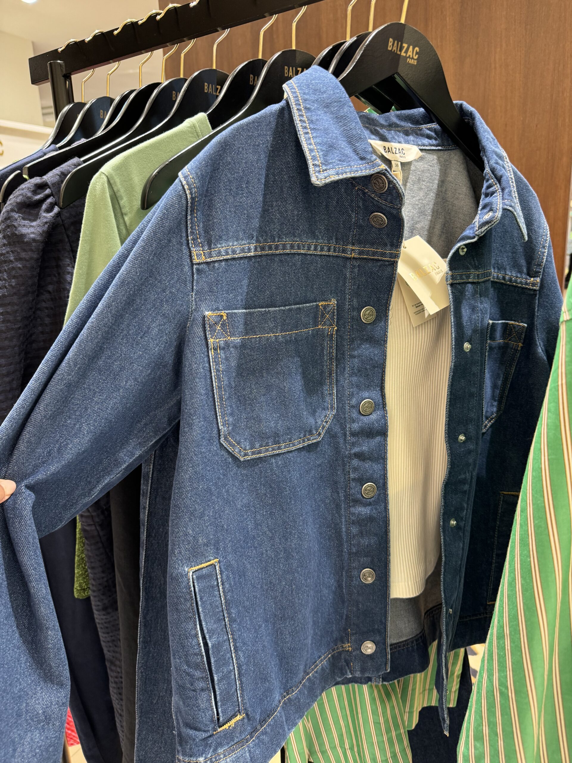 Denim jacket and clothing displayed inside Balzac Paris boutique in Saint-Germain neighborhood