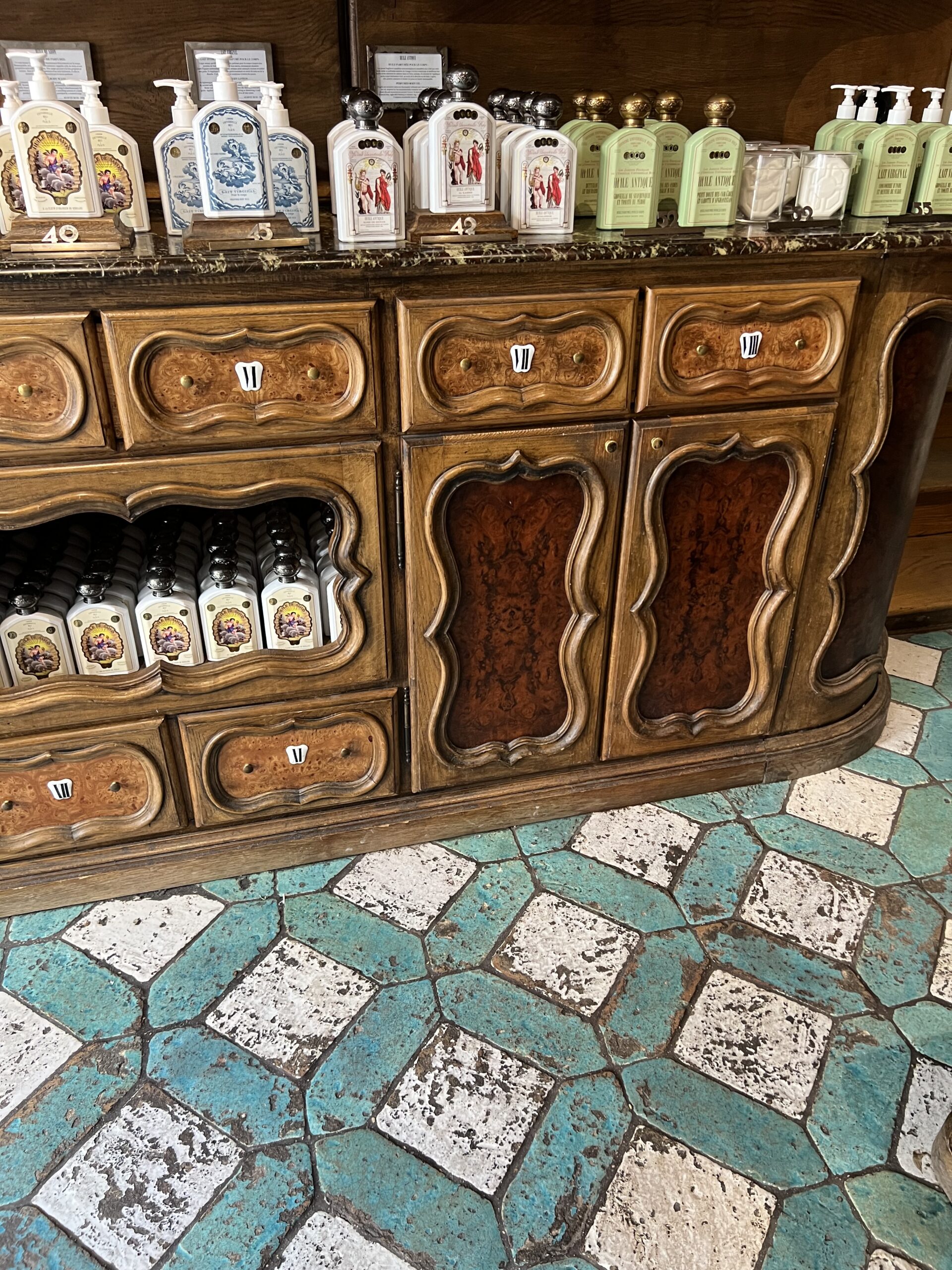 Interior of Buly 1803 store in Saint-Germain-des-Prés with vintage wood cabinets and French beauty products
