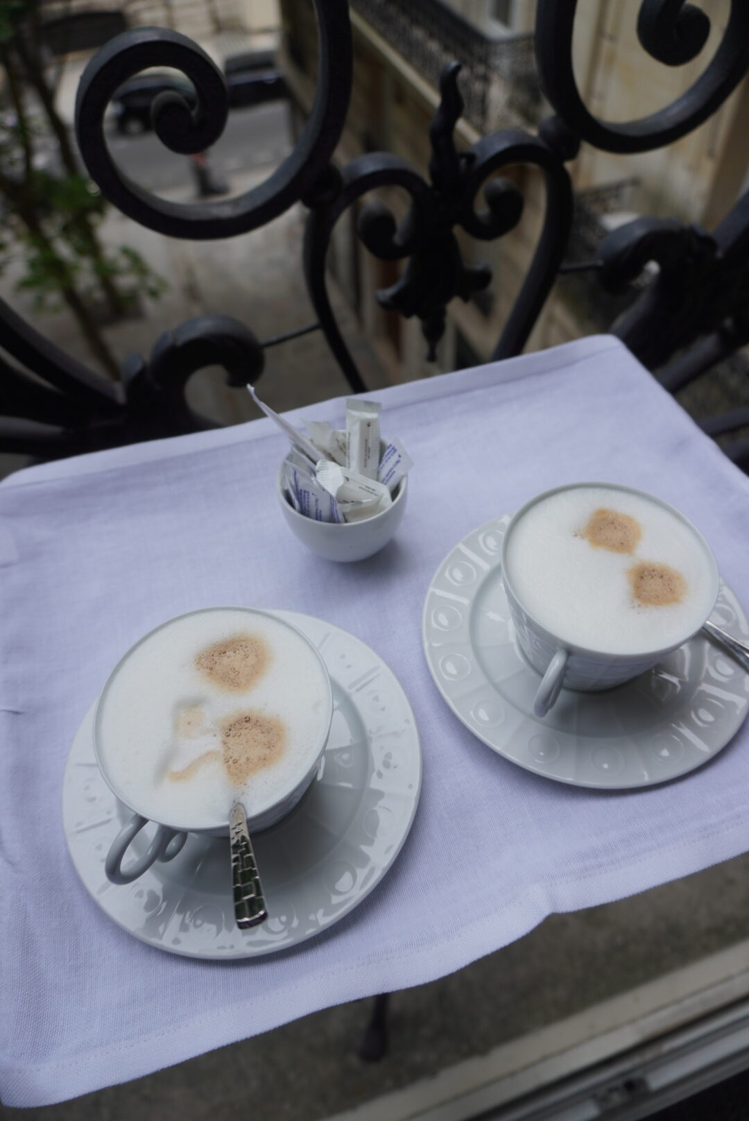 Coffee served on the balcony at Hôtel Récamier in Saint-Germain-des-Prés, Paris, overlooking the quiet Left Bank street