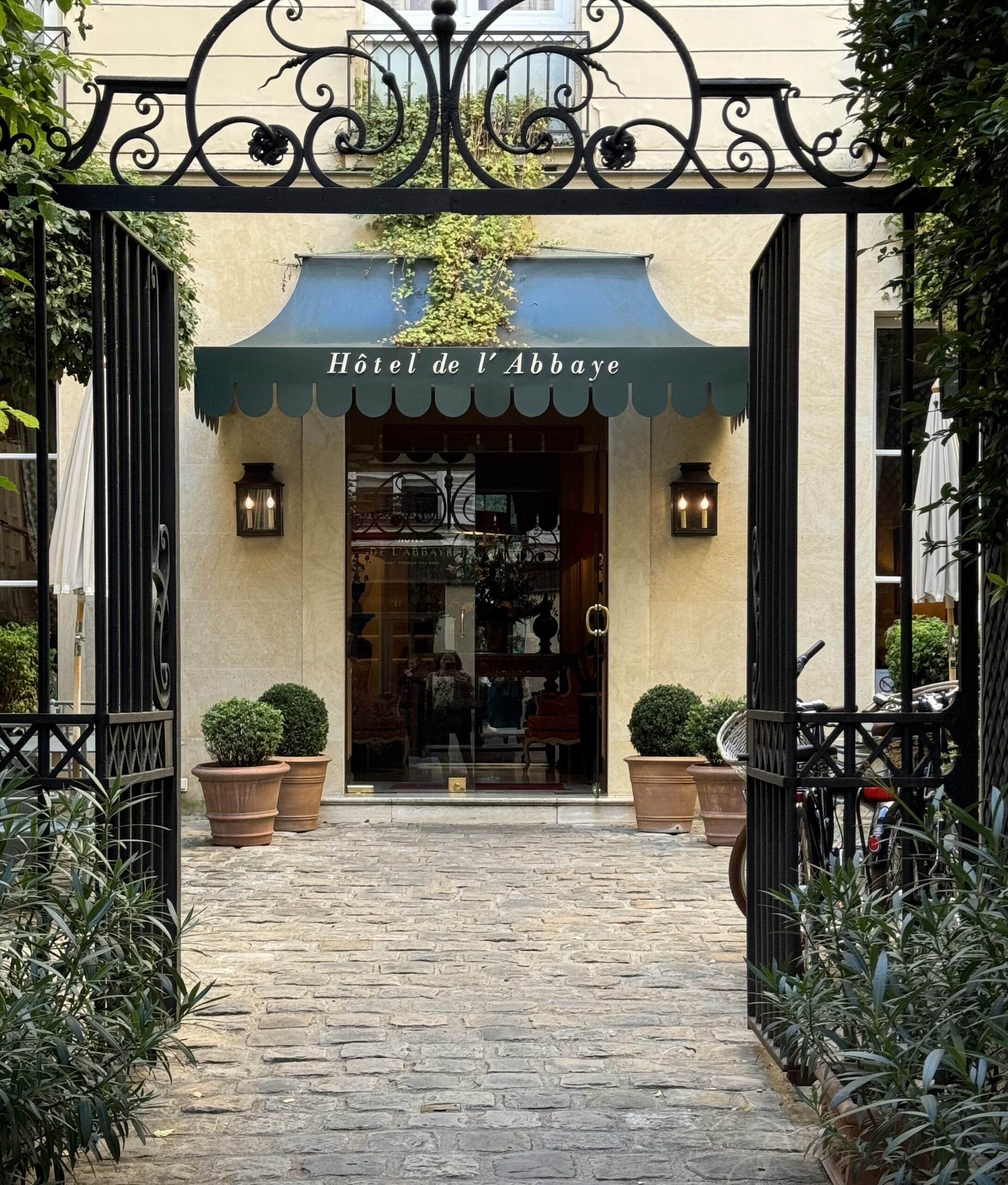 Entrance of Hôtel de l’Abbaye in Saint-Germain-des-Prés with courtyard gate and classic Paris architecture