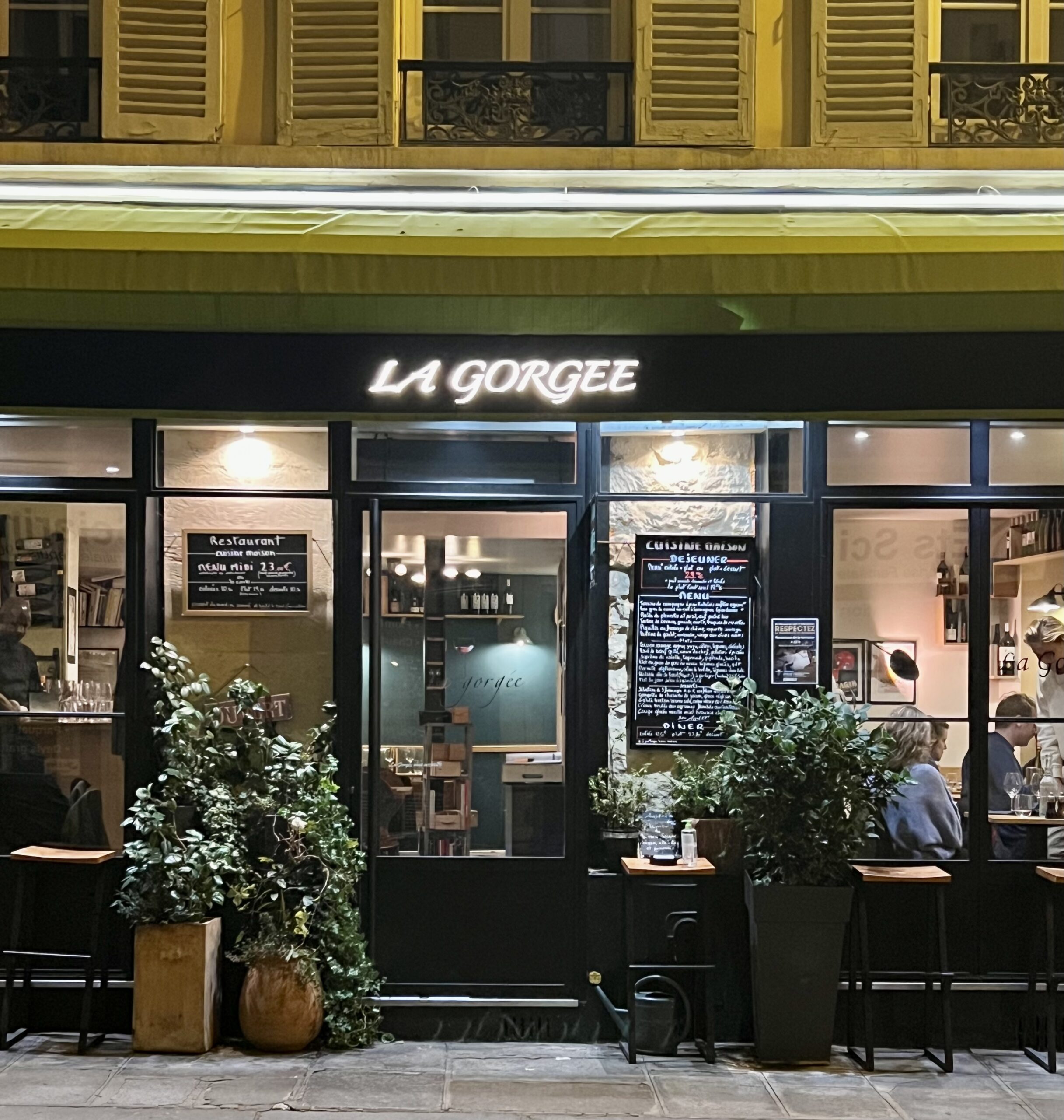 Exterior of La Gorgée restaurant in Saint-Germain-des-Prés Paris with classic bistro façade and outdoor tables.