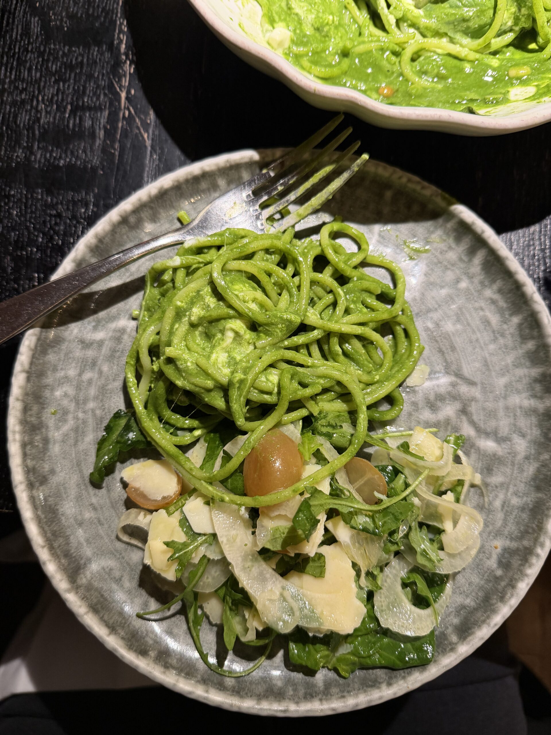 Plate of fresh green pasta served at Marcello Italian restaurant in Paris