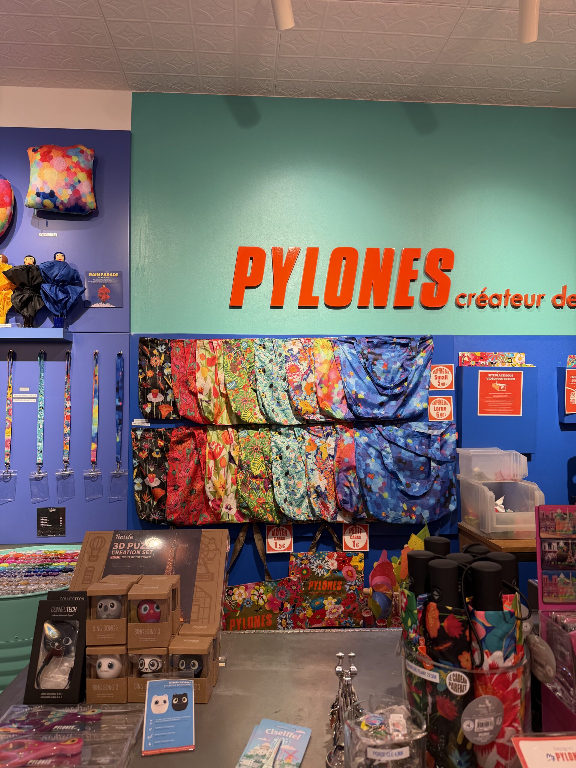 Colorful interior of Pylones gift store in Saint-Germain-des-Prés showcasing playful French design items.
