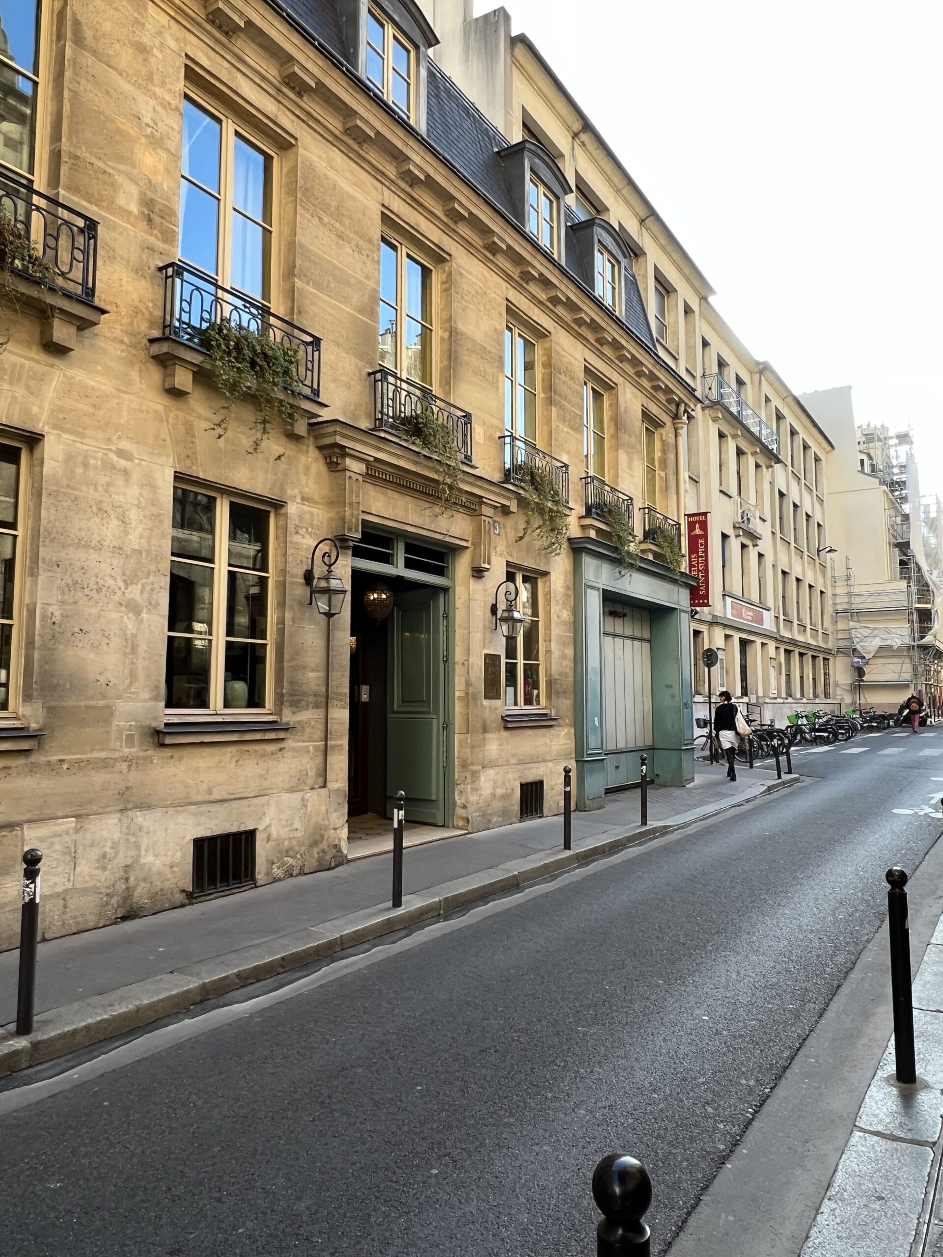 Street view of classic Parisian buildings in Saint-Germain-des-Prés neighborhood.