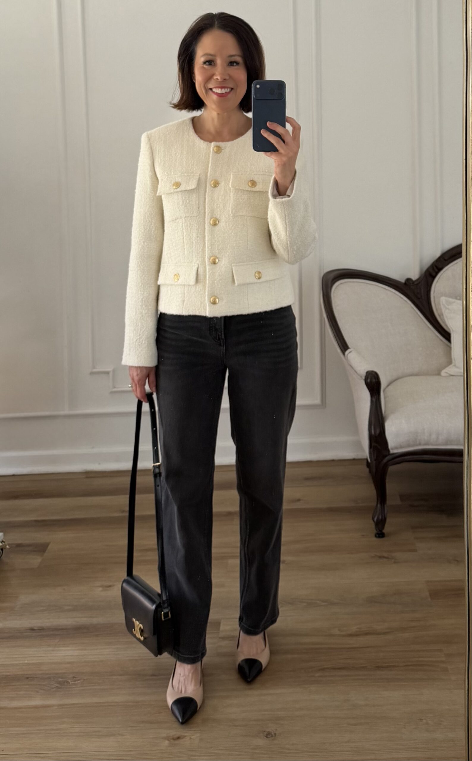 Cream tweed jacket with black straight-leg jeans, two-tone cap-toe heels, and a structured black Celine crossbody bag — classic French girl style