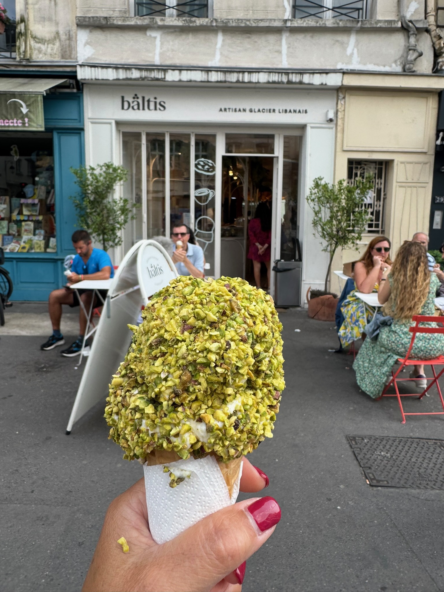 Lebanese ice cream covered in crushed pistachios from Baltis artisan glacier in Paris.