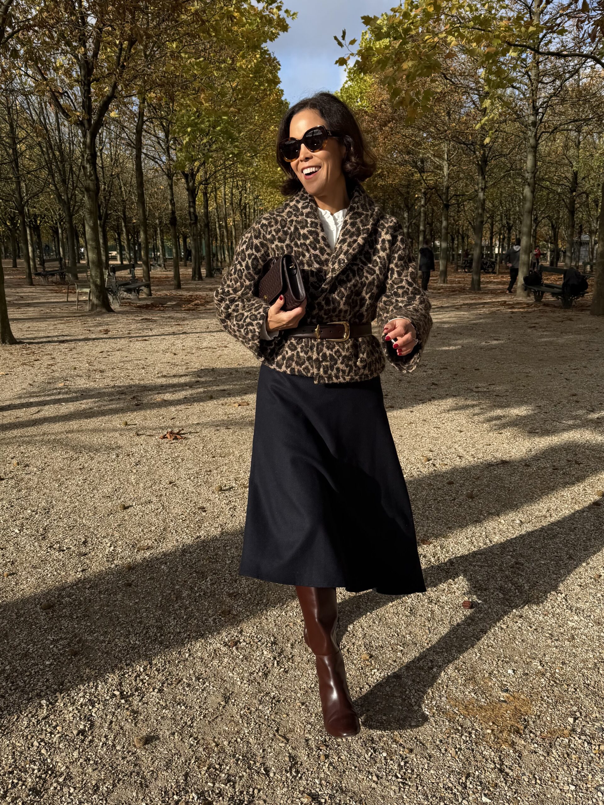 Walking in Luxembourg during the fall in a leopard jacket and skirt.