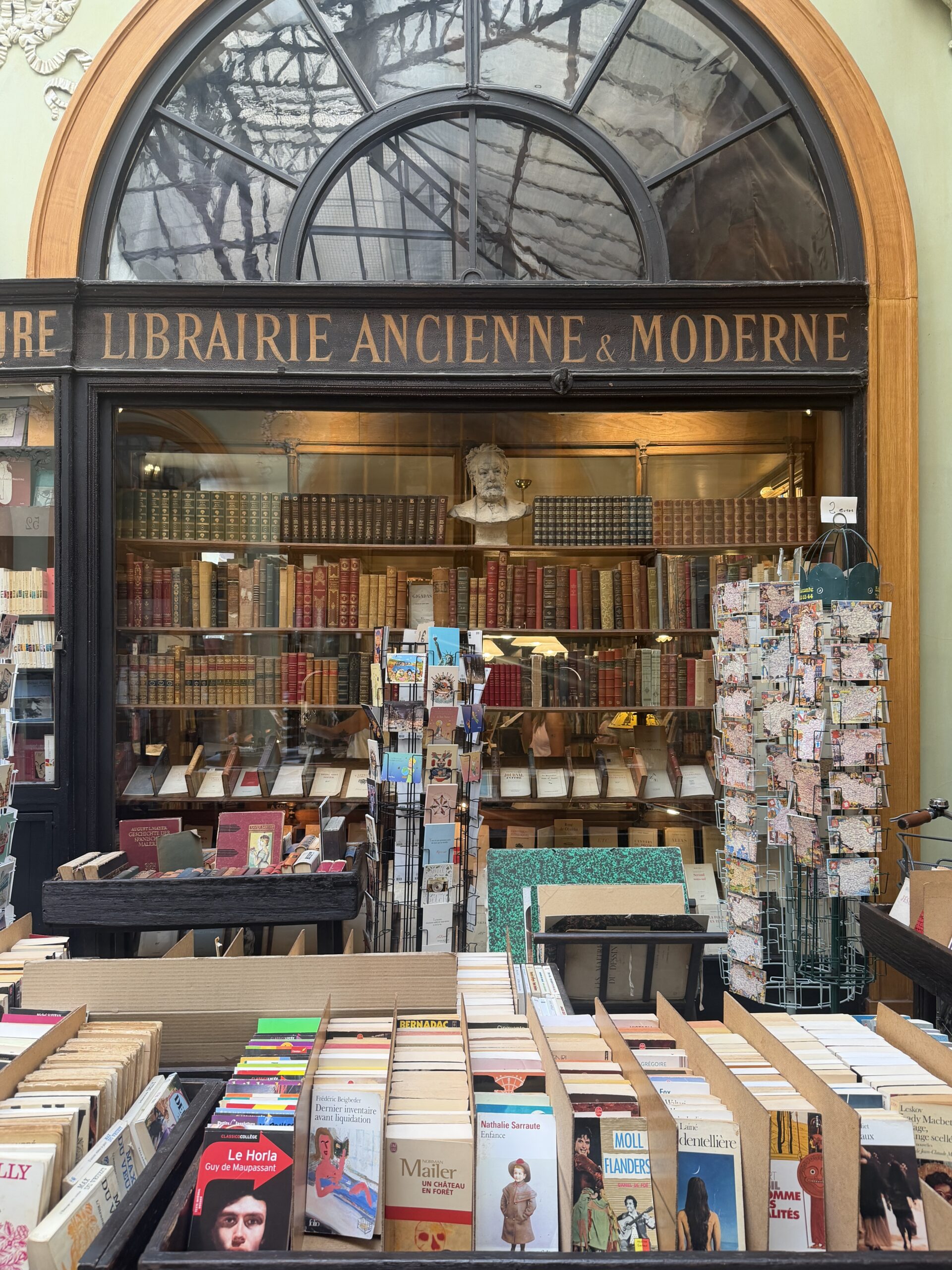 Bookstore in Paris with books outside the store being displayed