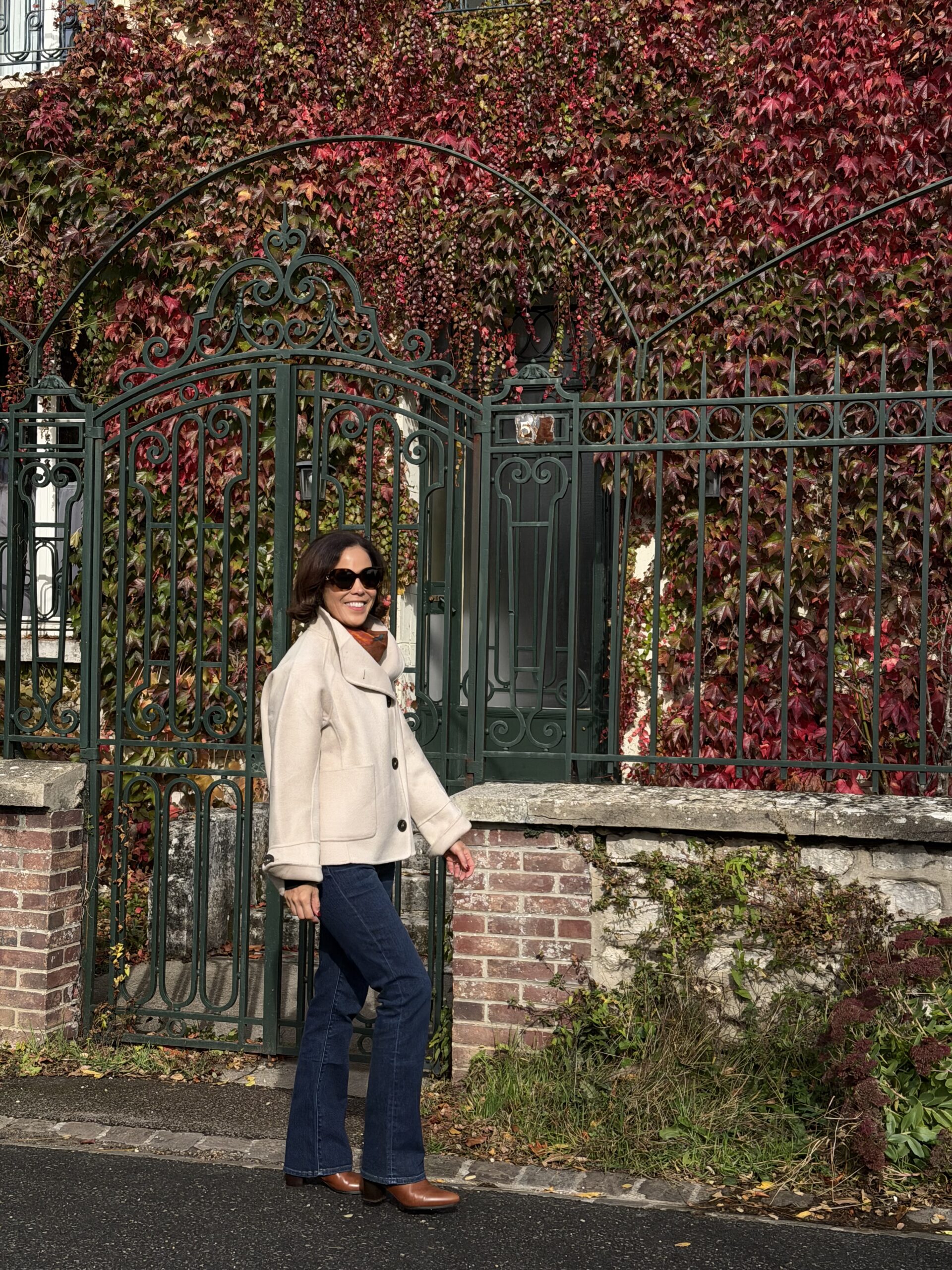 Walking amongst the leaves with a wool jacket and boots in fall.